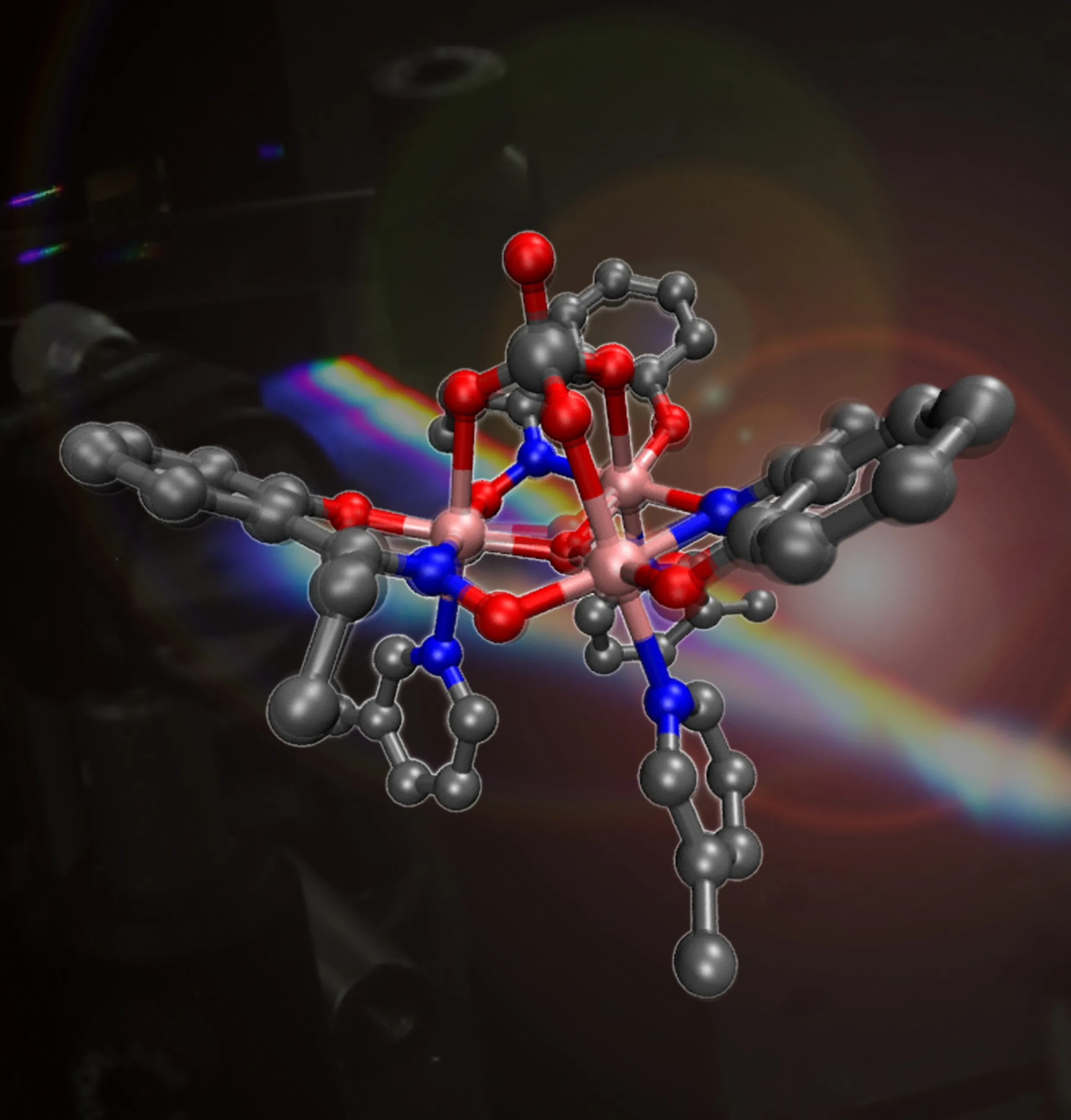 a model of a molecule using blue and red spheres and grey connections