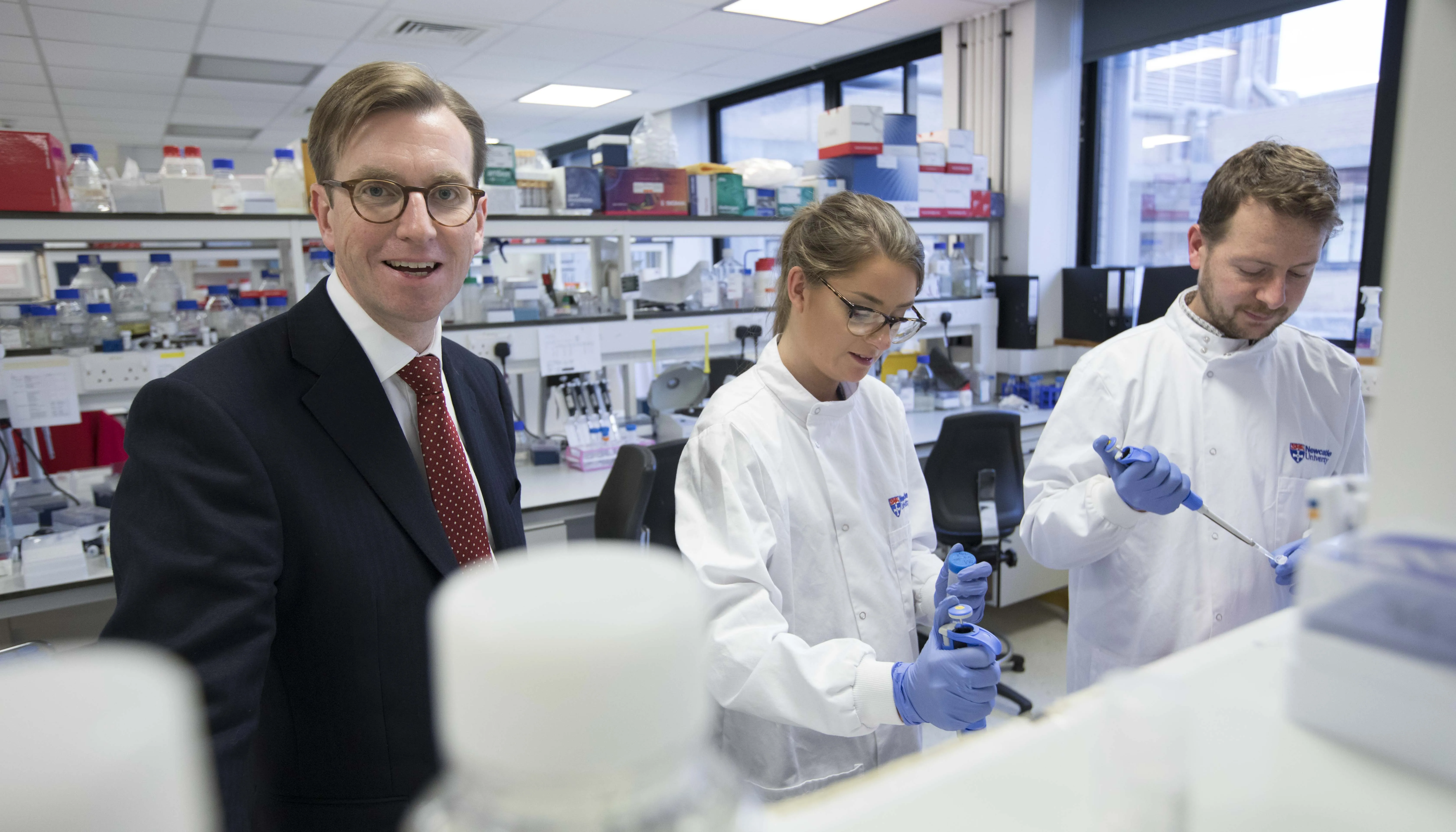 Professor Quentin Anstee in lab with scientists