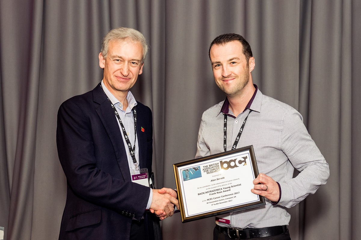 Image of Dr Alan Serrels receiving the BACR/AstraZeneca Young Scientist Frank Rose Award