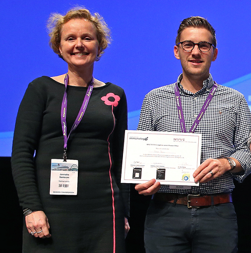 Calum is pictured receiving his certificate from Congress Secretary Janneke Samsom