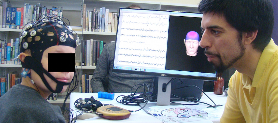 Dr Javier Escudero and child wearing an electroencephalogram